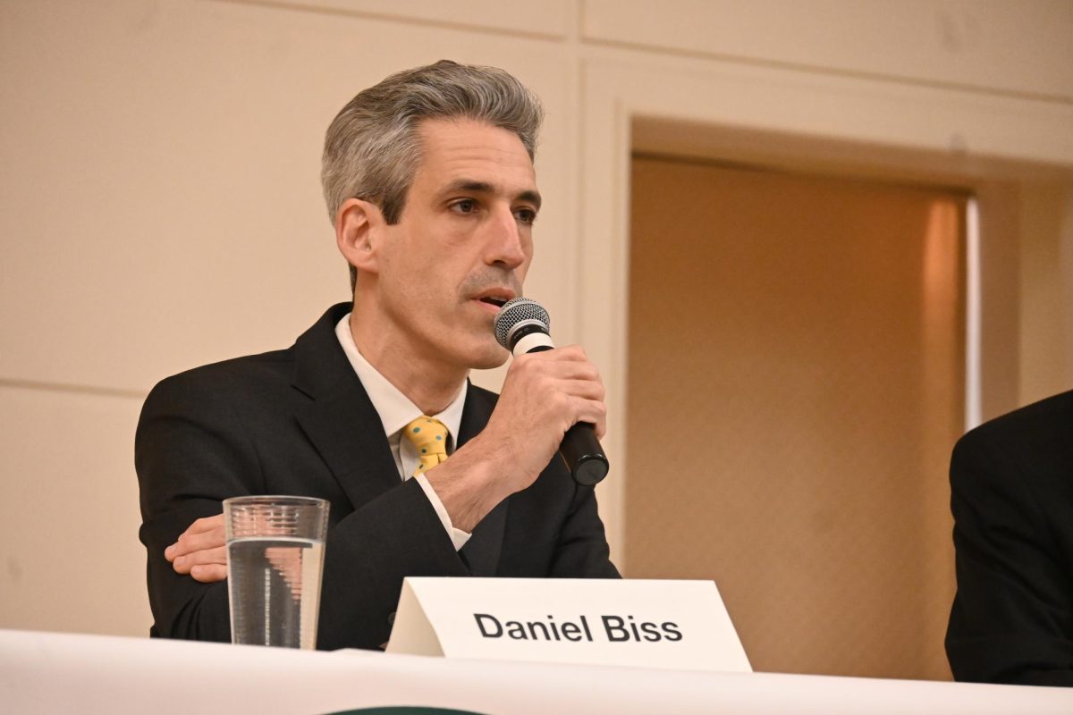 A man speaks into the microphone.