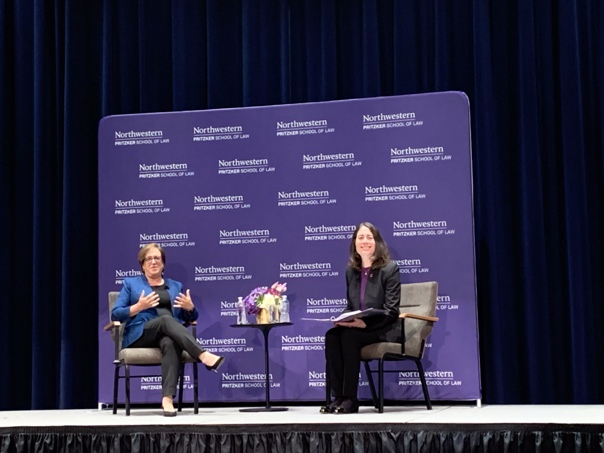 Two women, Pritzker Law School Dean Hari Osofsky and Supreme Court Justice Elena Kagan, sit across from each other on a stage.