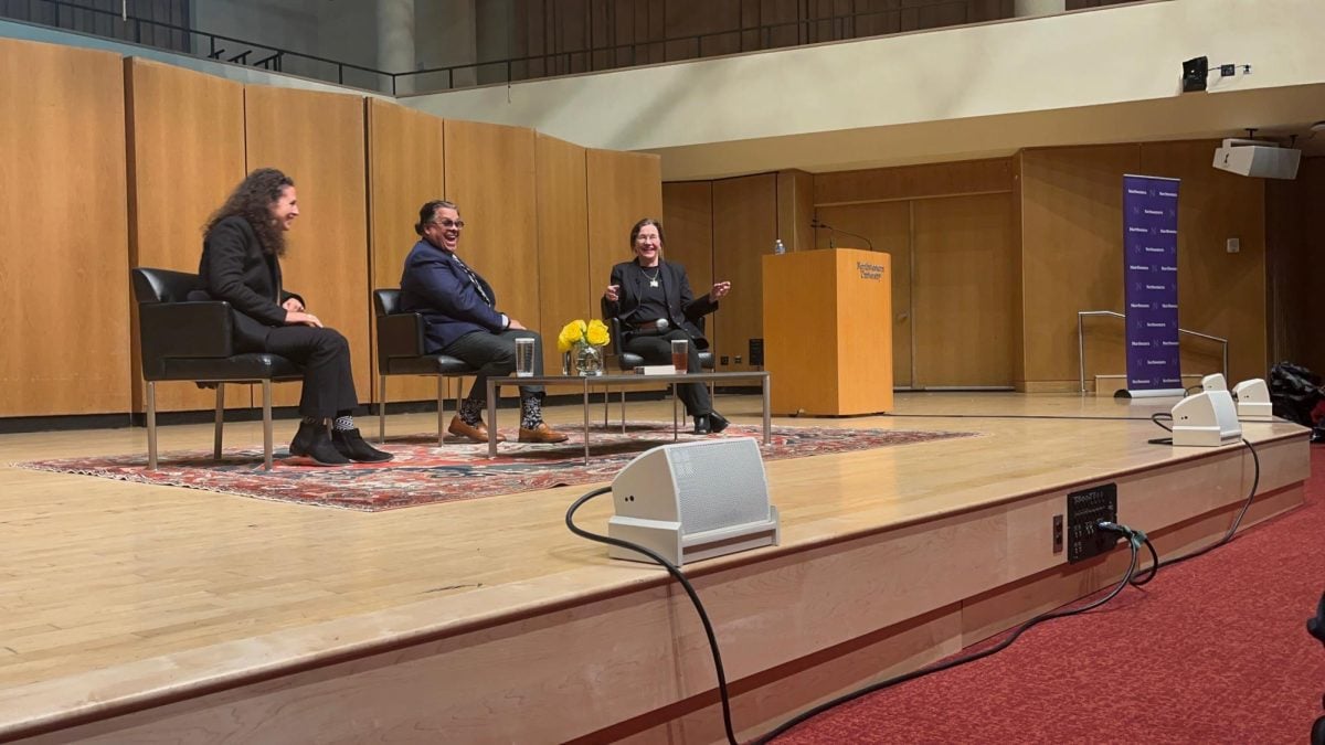 Three speakers sit on stage for a 2024-25 One Book One Northwestern event.