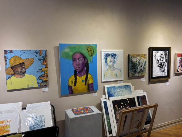 Five portraits hung on the wall.