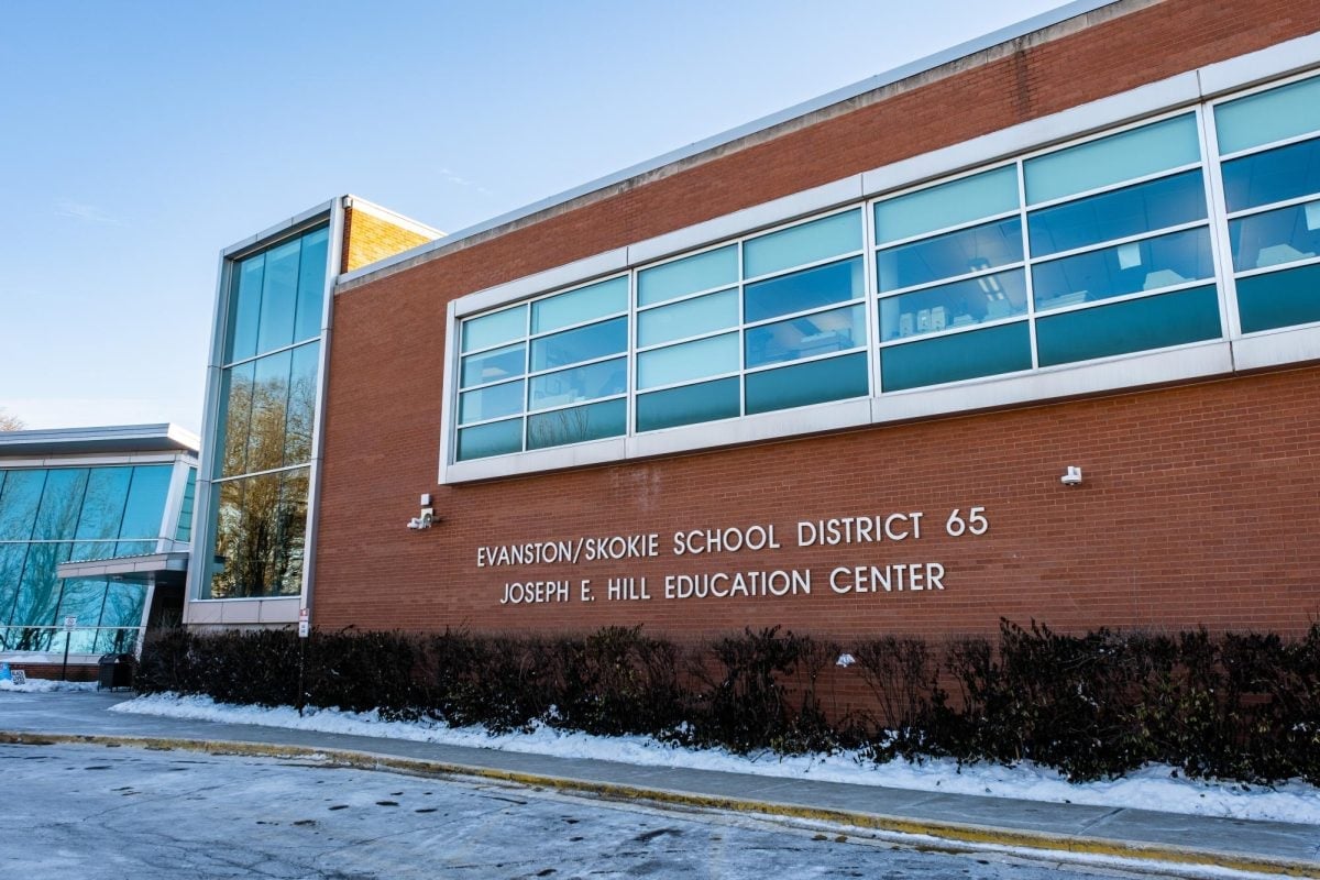 a building that says “Evanston/Skokie School District 65 Joseph E. Hill Education Center” on it